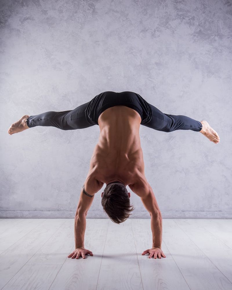 A close-up shot of a man's muscular back during a core exercise, showing focus and determination.